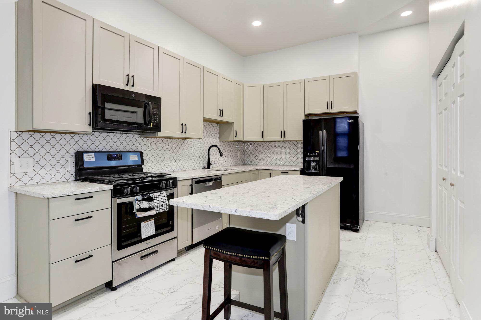 638 G Street Northeast Washington, DC 20002 - Photo 1 of 25 a kitchen with stainless steel appliances a stove microwave and refrigerator