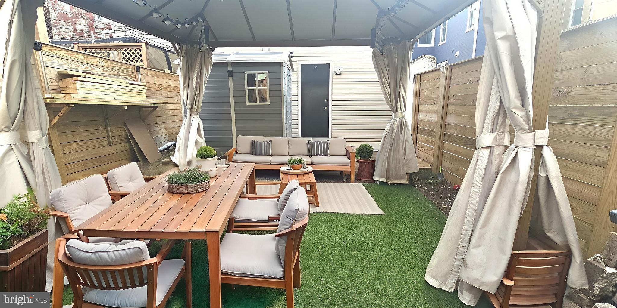 638 G Street Northeast Washington, DC 20002 - Photo 15 of 25 a table and chairs in the patio