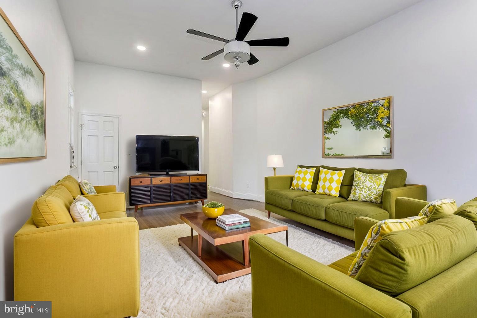 638 G Street Northeast Washington, DC 20002 - Photo 2 of 25 a living room with furniture and a flat screen tv