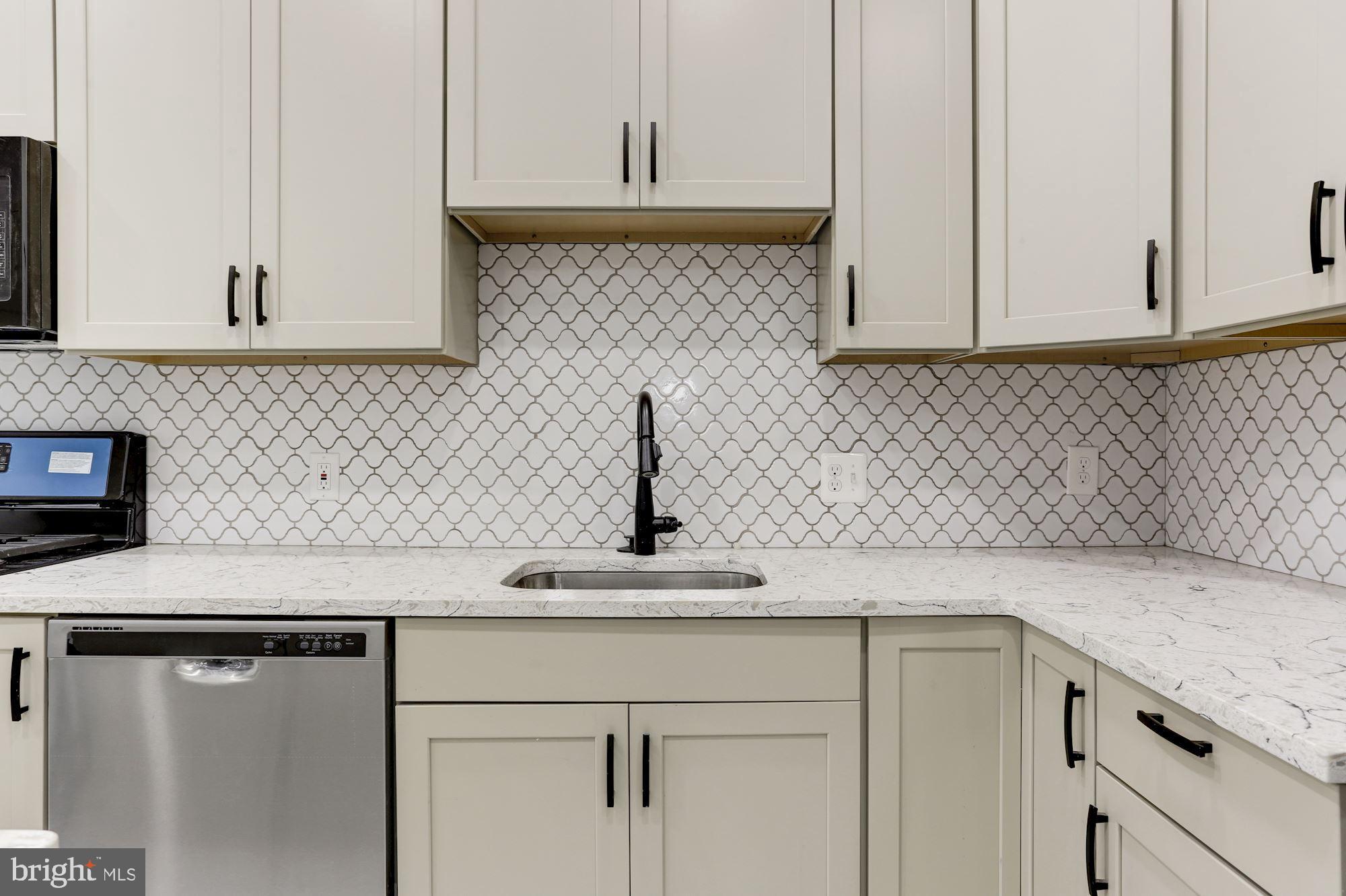 638 G Street Northeast Washington, DC 20002 - Photo 4 of 25 a kitchen with a sink and cabinets