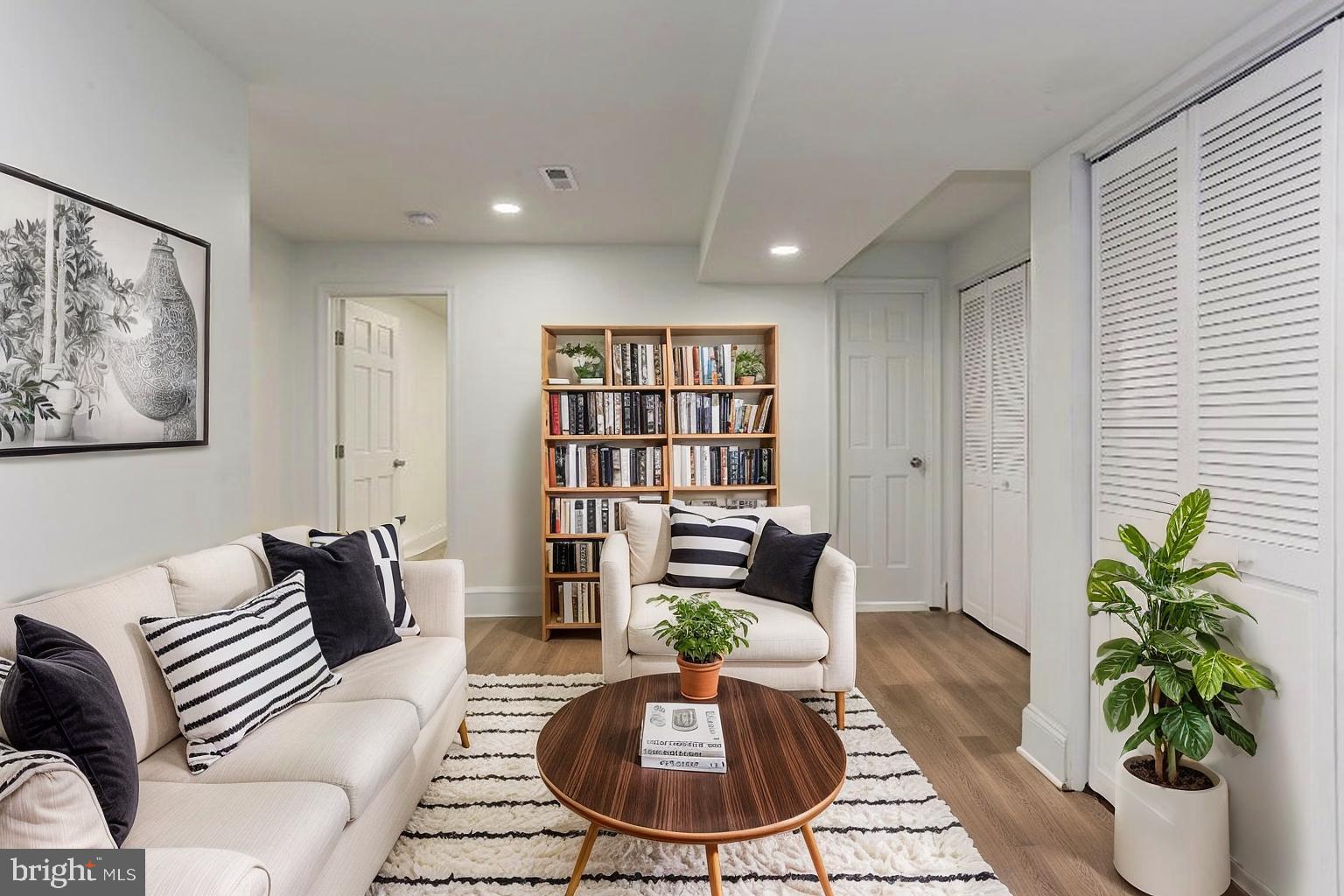638 G Street Northeast Washington, DC 20002 - Photo 10 of 25 a living room with furniture potted plant and a window