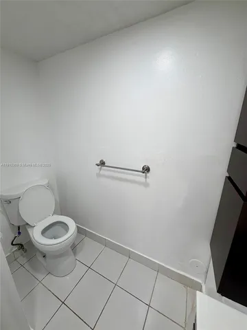 a bathroom with a toilet and a sink