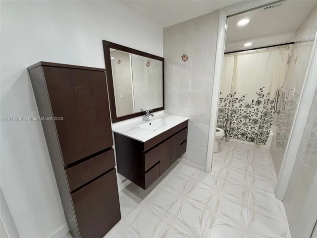 a room with cabinets and wooden floor