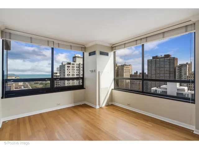 a view of a living room with a large window