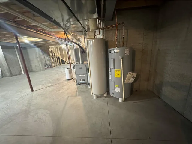 a view of empty room with wooden floor and door
