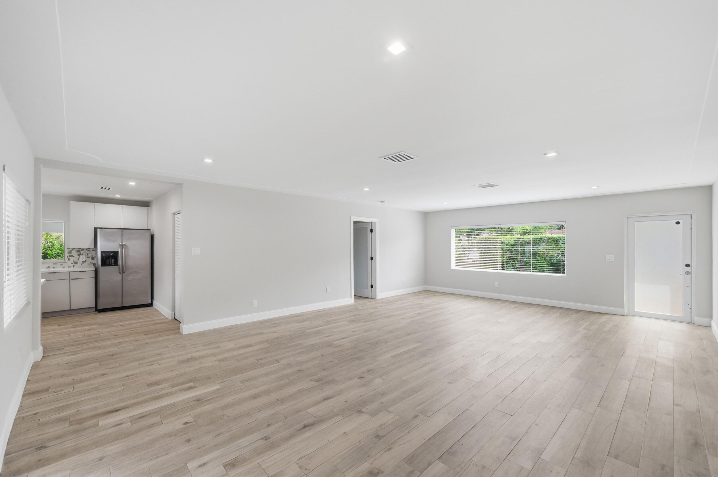 1770 Southwest 17th Avenue Miami, FL 33145 - Photo 13 of 46 a view of empty room with wooden floor and window
