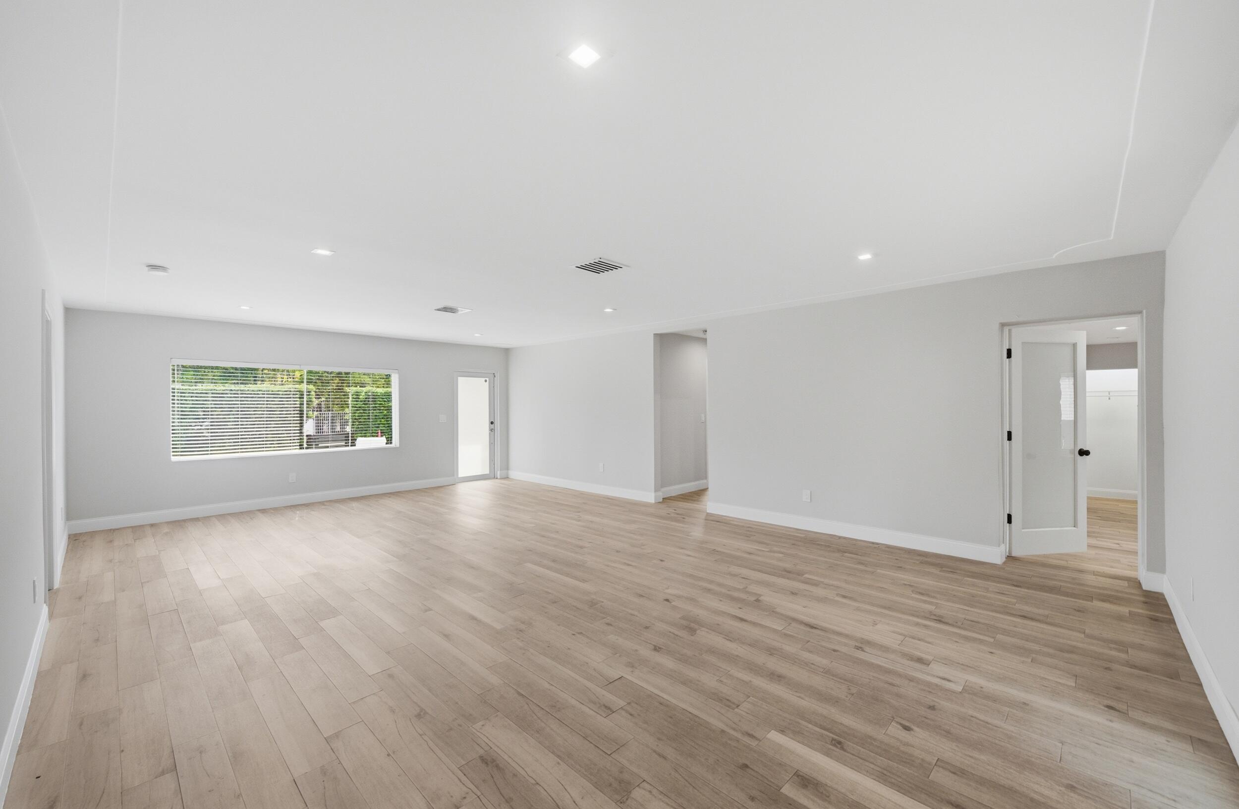 1770 Southwest 17th Avenue Miami, FL 33145 - Photo 14 of 46 a view of an empty room with wooden floor and a window