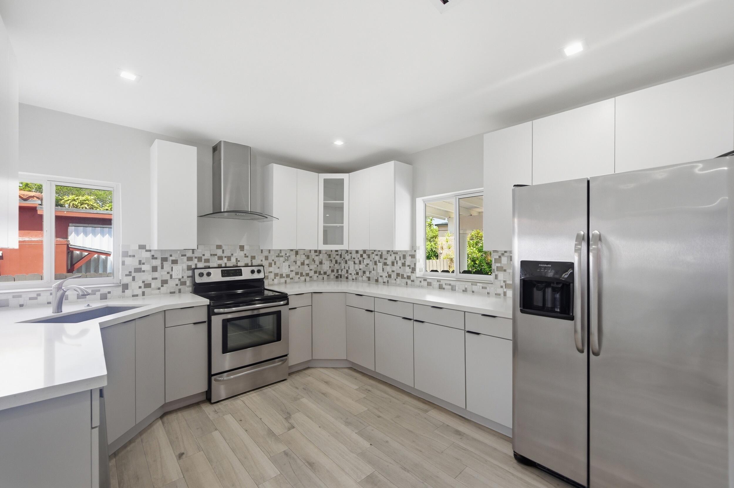 1770 Southwest 17th Avenue Miami, FL 33145 - Photo 15 of 46 a kitchen with a sink stove and refrigerator