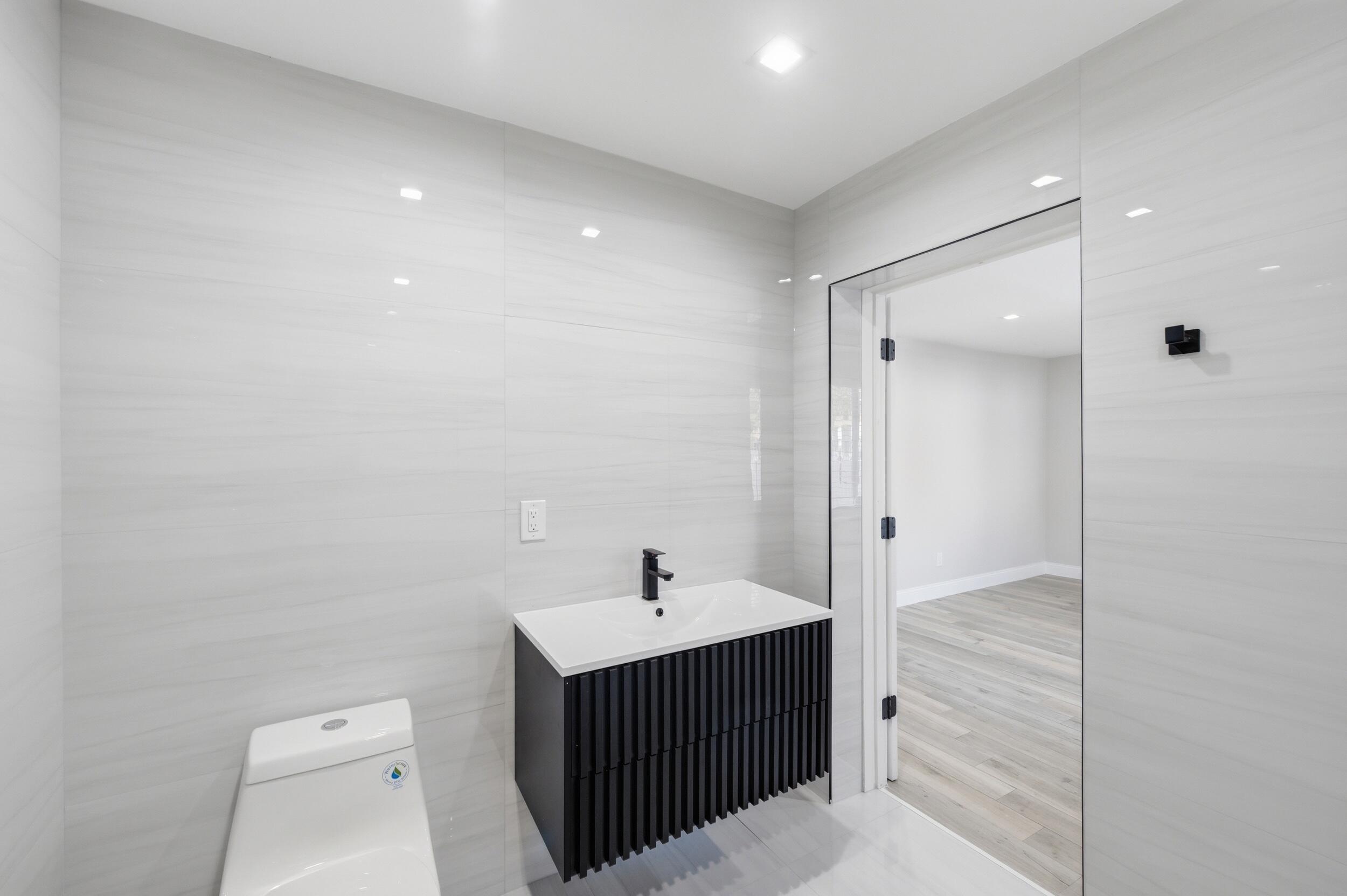 1770 Southwest 17th Avenue Miami, FL 33145 - Photo 23 of 46 a bathroom with a sink and a mirror