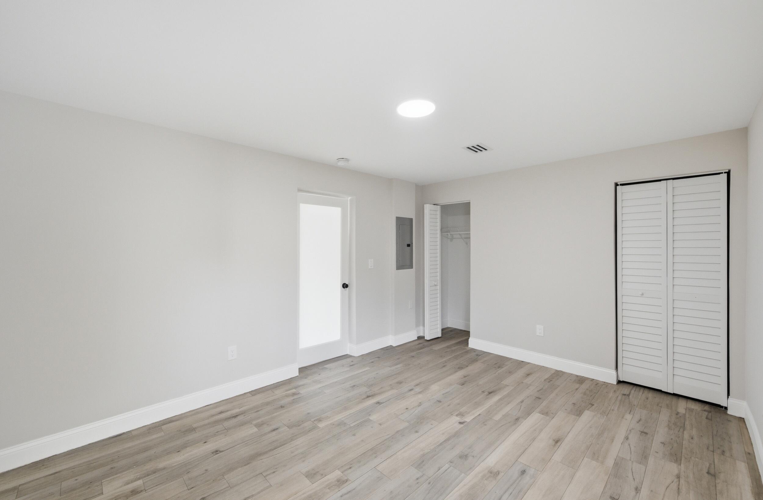 1770 Southwest 17th Avenue Miami, FL 33145 - Photo 25 of 46 a view of an empty room with wooden floor
