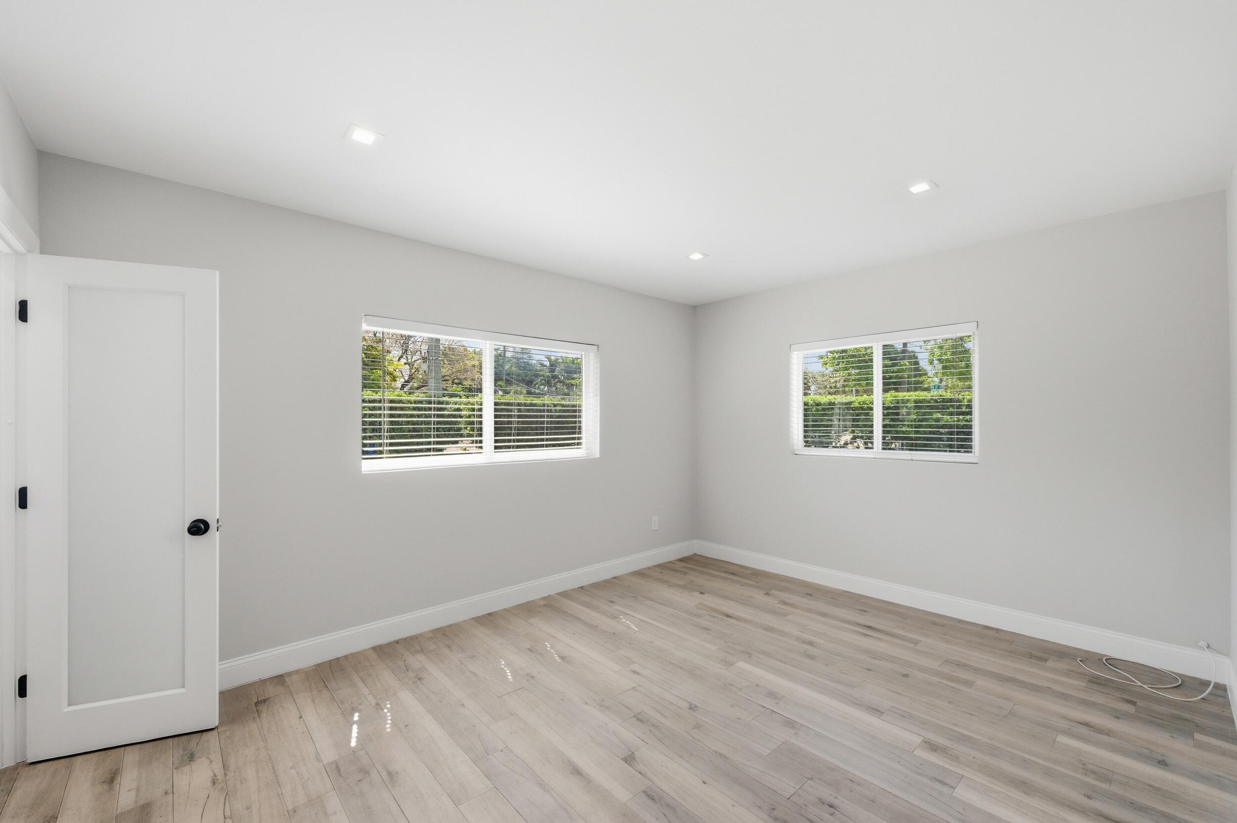 1770 Southwest 17th Avenue Miami, FL 33145 - Photo 27 of 46 an empty room with wooden floor and windows