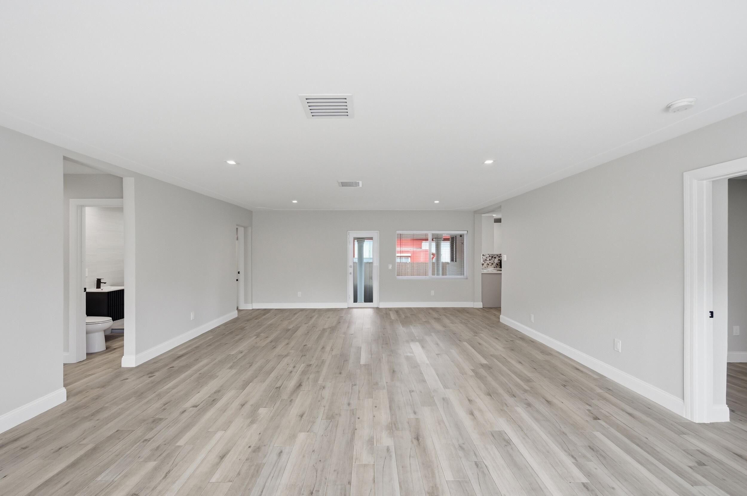 1770 Southwest 17th Avenue Miami, FL 33145 - Photo 33 of 46 an empty room with wooden floor and windows