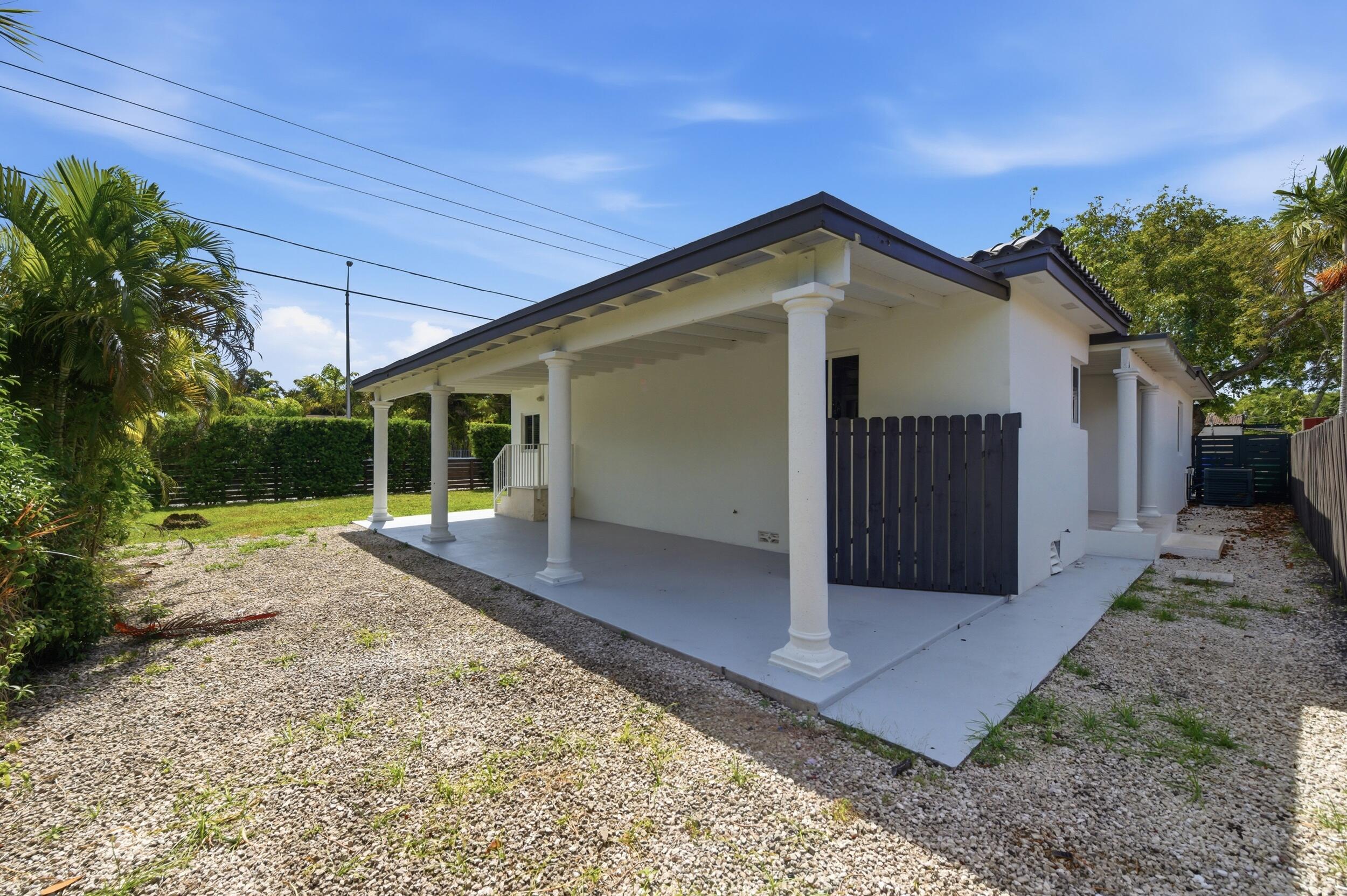 1770 Southwest 17th Avenue Miami, FL 33145 - Photo 7 of 46 a view of a house with a yard and potted plants