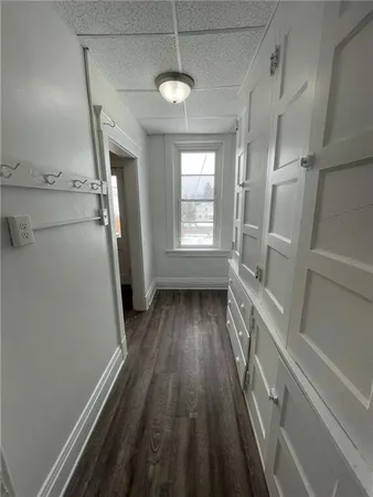 a view of a room with wooden floor and staircase