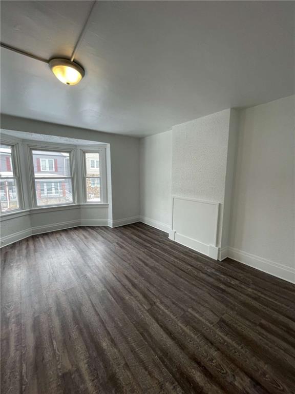 136 South Spring Avenue Greensburg, PA 15601 - Photo 24 of 46 an empty room with wooden floor and windows