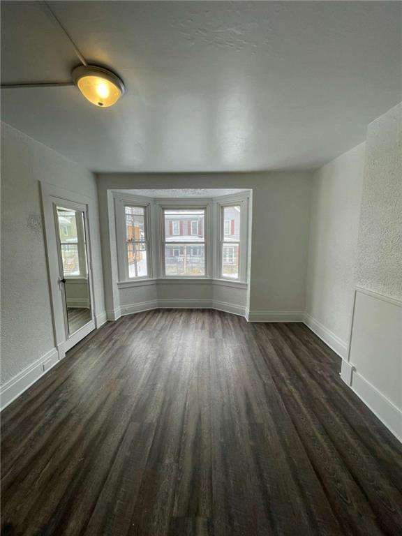 136 South Spring Avenue Greensburg, PA 15601 - Photo 25 of 46 an empty room with wooden floor and windows