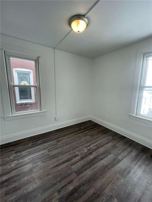 136 South Spring Avenue Greensburg, PA 15601 - Photo 33 of 46 a view of an empty room with wooden floor and a window