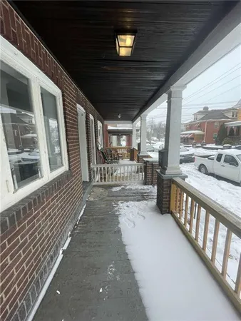 a view of a porch with furniture