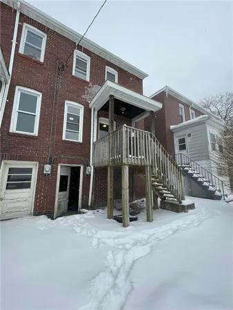a view of a balcony with furniture