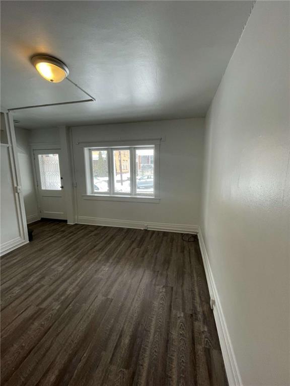 136 South Spring Avenue Greensburg, PA 15601 - Photo 9 of 46 an empty room with wooden floor and windows