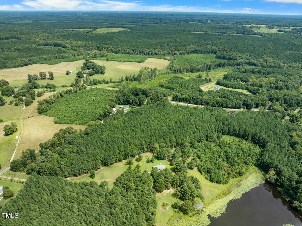4110 Wilson Town Road Oxford, NC 27565 - Photo 4 of 9 a view of a lake with a houses
