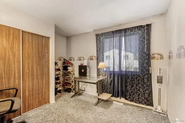 a view of a bedroom with natural light