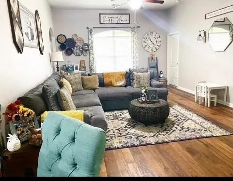 a living room with furniture and a table