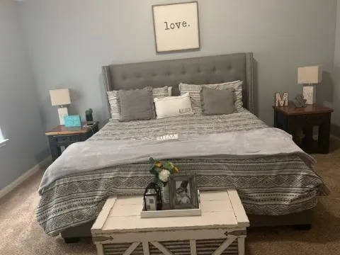 a bedroom with a bed and bathroom