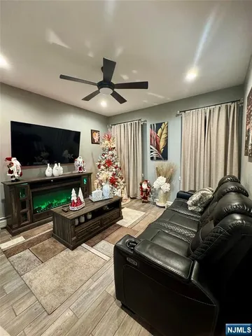 a bed room with furniture and a flat screen tv