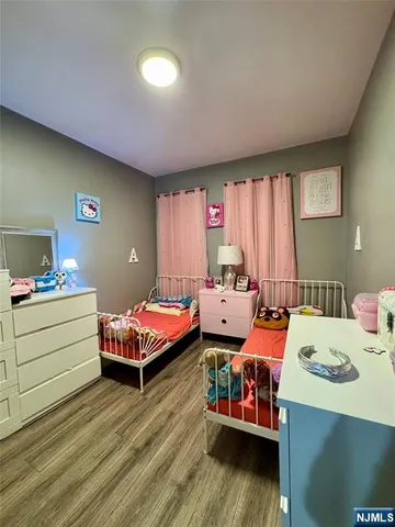 a bed room with a bed and a dresser