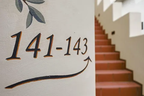 a view of staircase with white walls