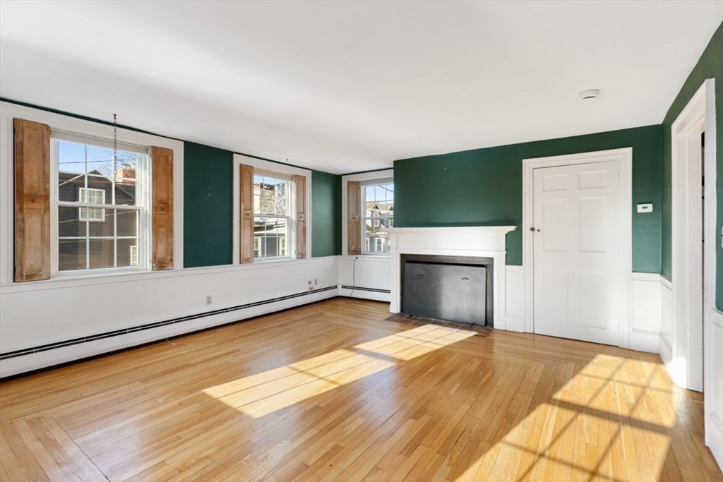 14 Mall Street, Unit B Salem, MA 01970 - Photo 15 of 30 a view of an empty room with a fireplace and a window
