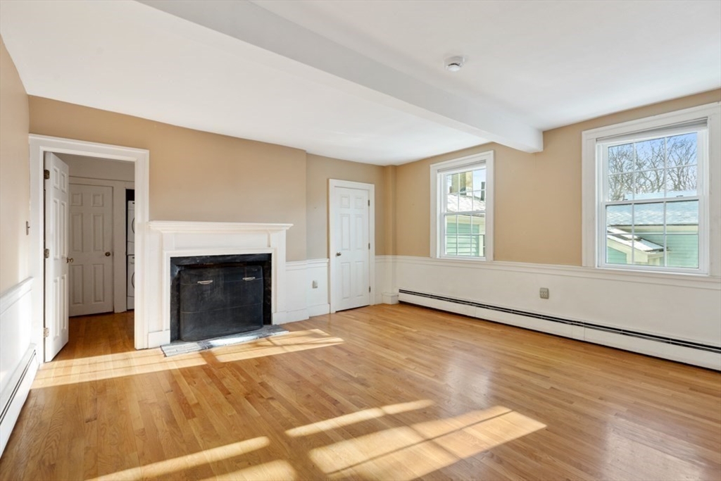 14 Mall Street, Unit B Salem, MA 01970 - Photo 18 of 30 a view of an empty room with window and fire place