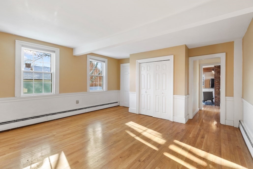 14 Mall Street, Unit B Salem, MA 01970 - Photo 19 of 30 a view of an empty room with wooden floor and a window