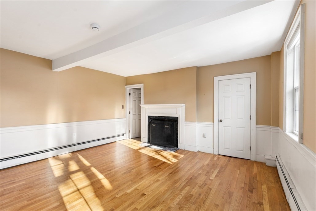 14 Mall Street, Unit B Salem, MA 01970 - Photo 20 of 30 a view of an empty room with a fireplace and a window