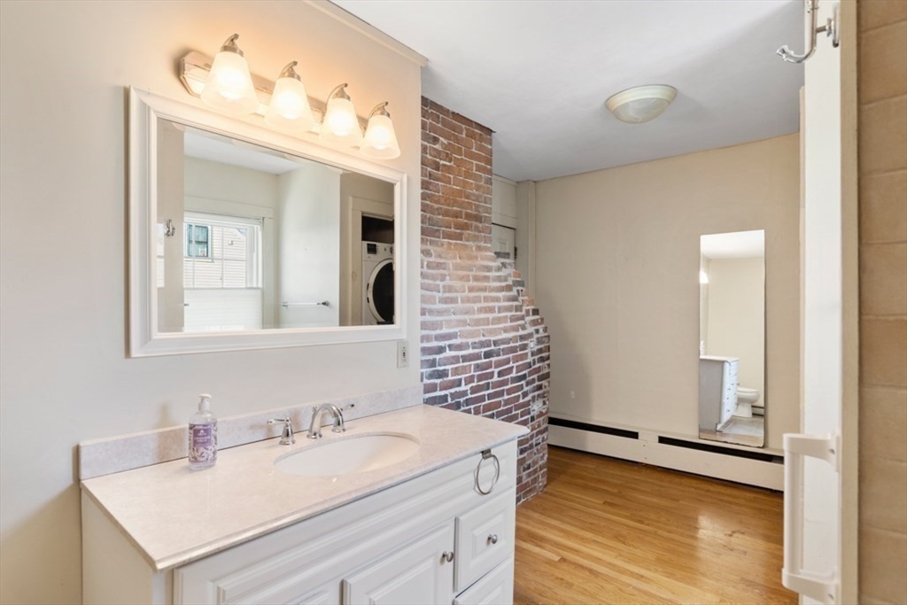 14 Mall Street, Unit B Salem, MA 01970 - Photo 24 of 30 a bathroom with a sink and a mirror