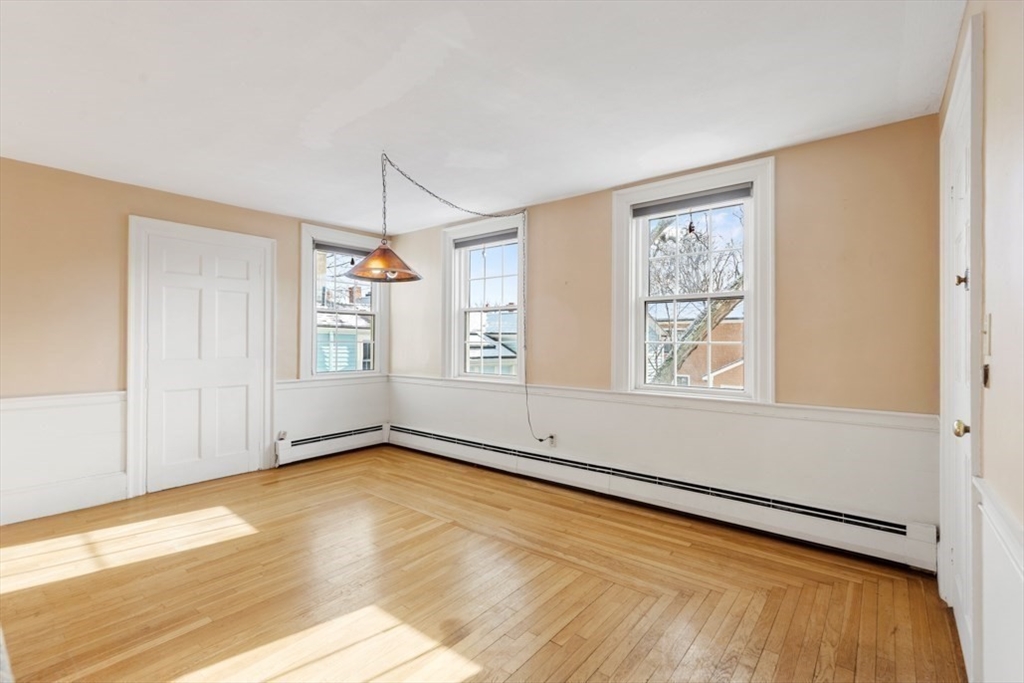 14 Mall Street, Unit B Salem, MA 01970 - Photo 5 of 30 wooden floor in an empty room with a window
