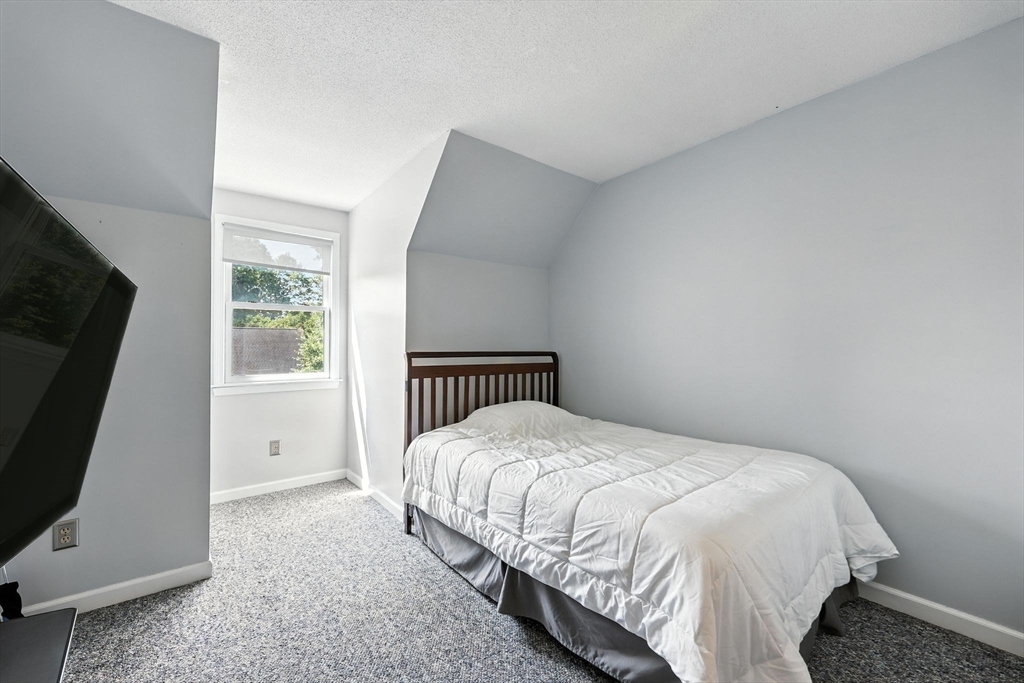 79 Stephanie Circle Springfield, MA 01129 - Photo 23 of 29 a bed sitting in a bedroom next to a window