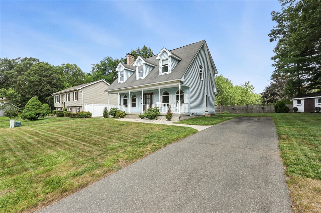 79 Stephanie Circle Springfield, MA 01129 - Photo 29 of 29 a front view of a house with a yard and potted plants