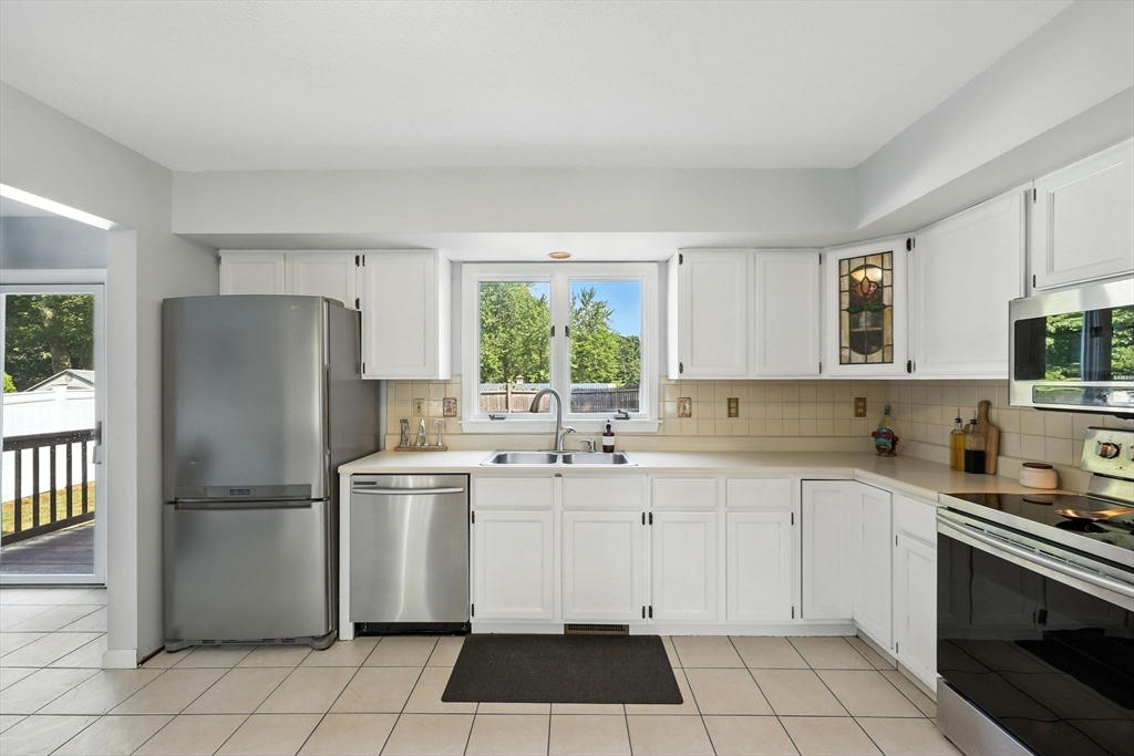 79 Stephanie Circle Springfield, MA 01129 - Photo 9 of 29 a kitchen with appliances cabinets and a sink