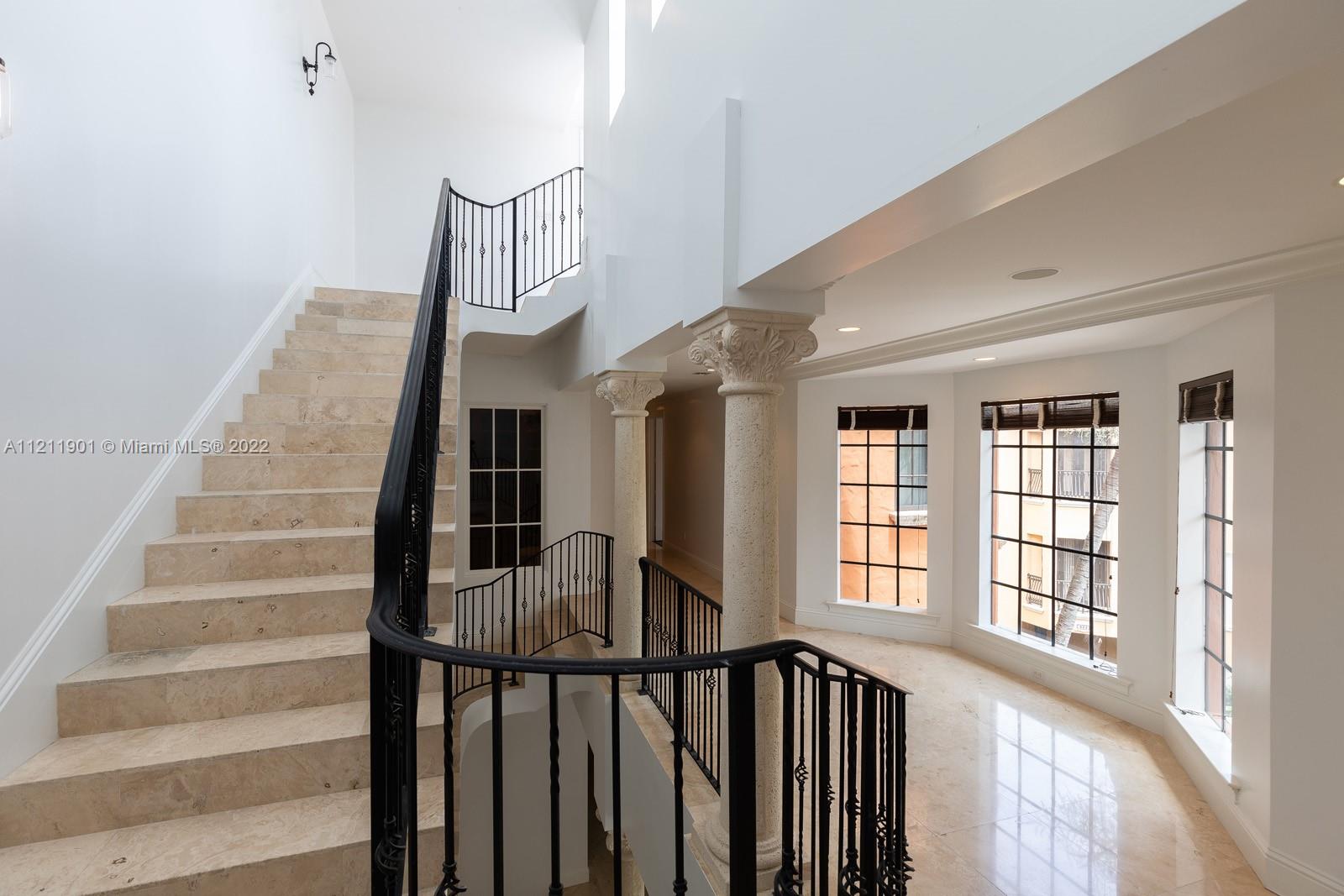 3471 Main Highway, Unit 928 Miami, FL 33133 - Photo 7 of 35 a view of entryway and hall with wooden floor