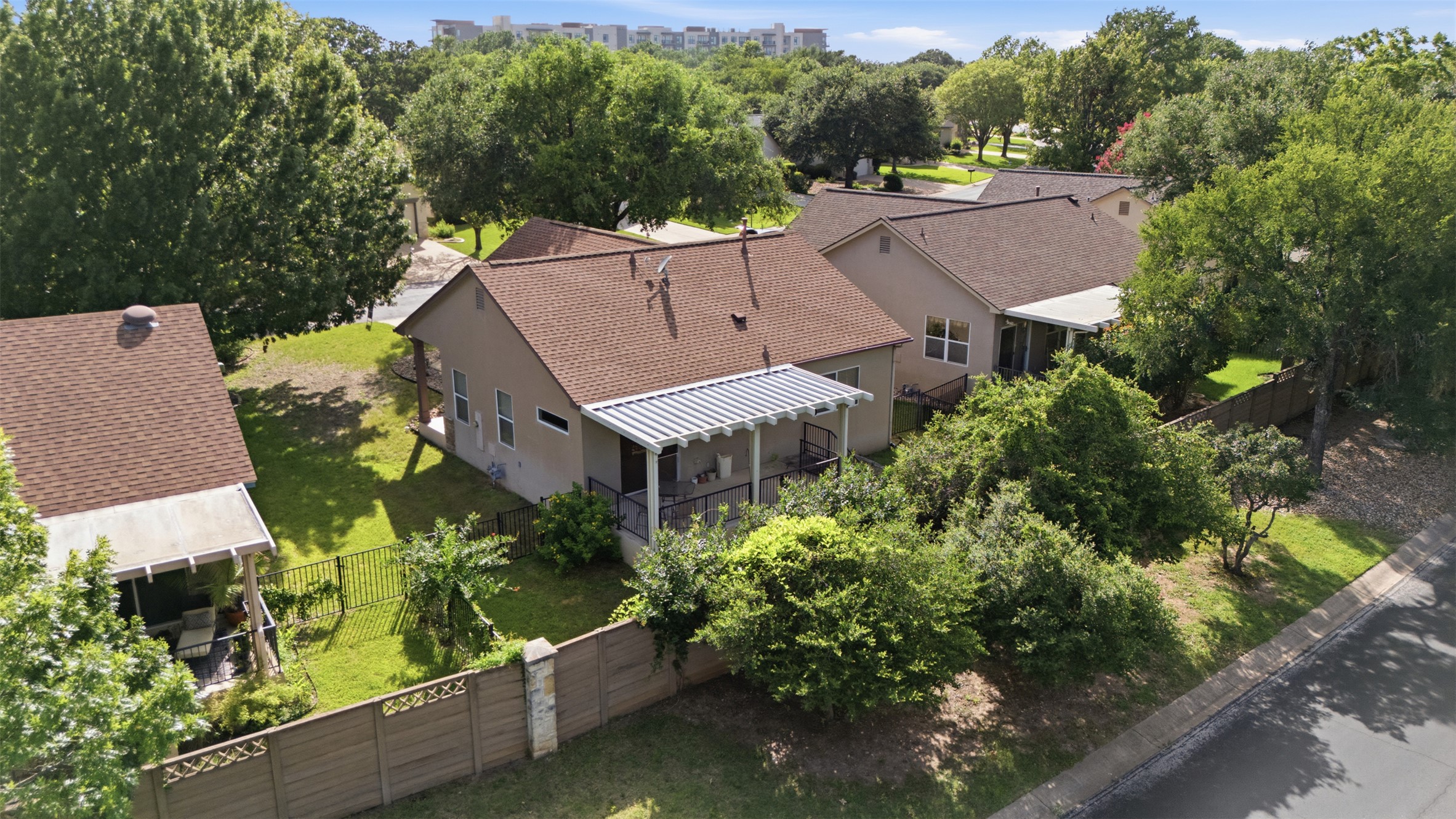 126 Whitewing Way Georgetown, TX 78633 - Photo 4 of 28 A private, fenced yard awaits behind this charming single-story residence with a covered patio.