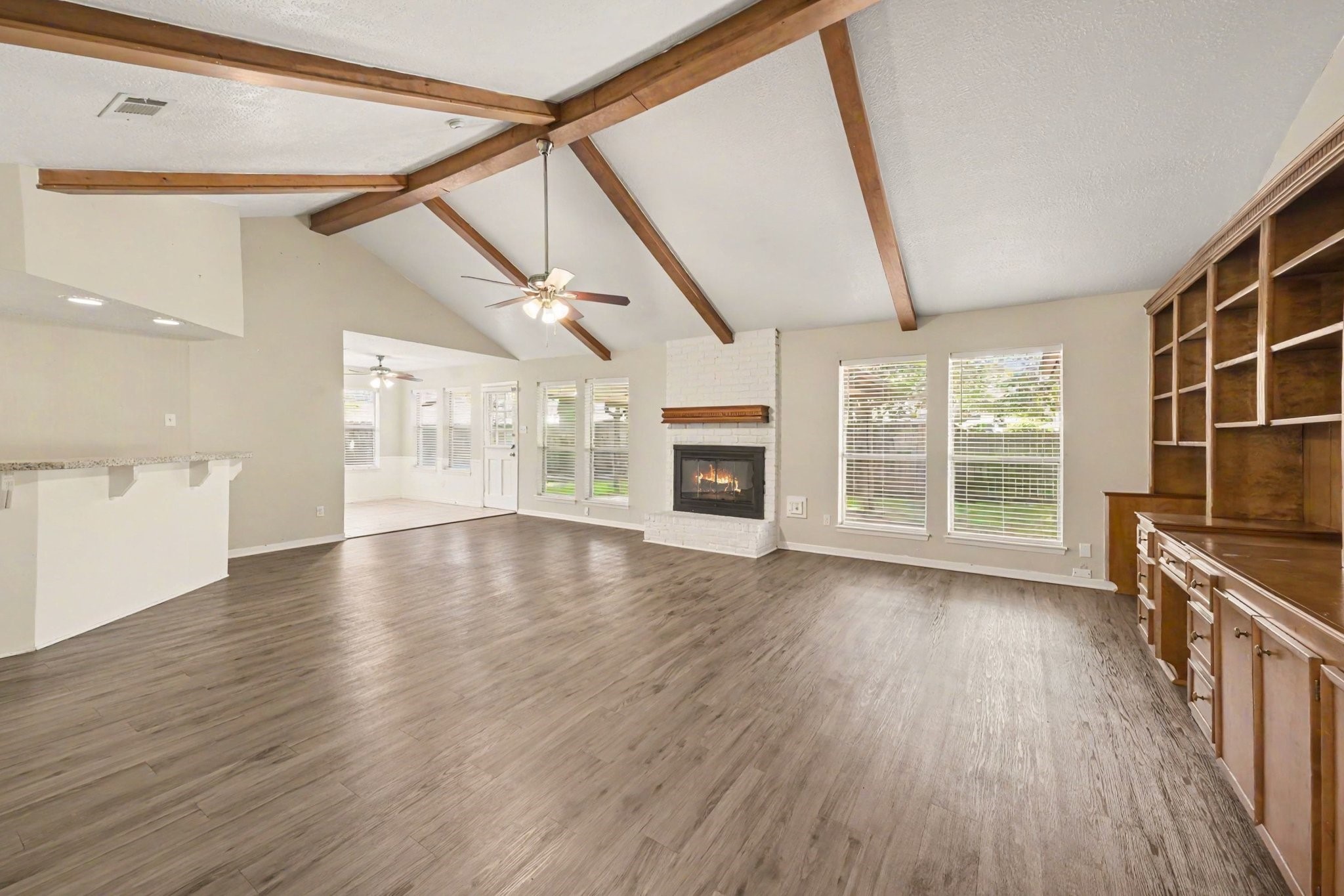 17419 Cassina Drive Spring, TX 77388 - Photo 9 of 35 a view of an empty room with wooden floor and a window
