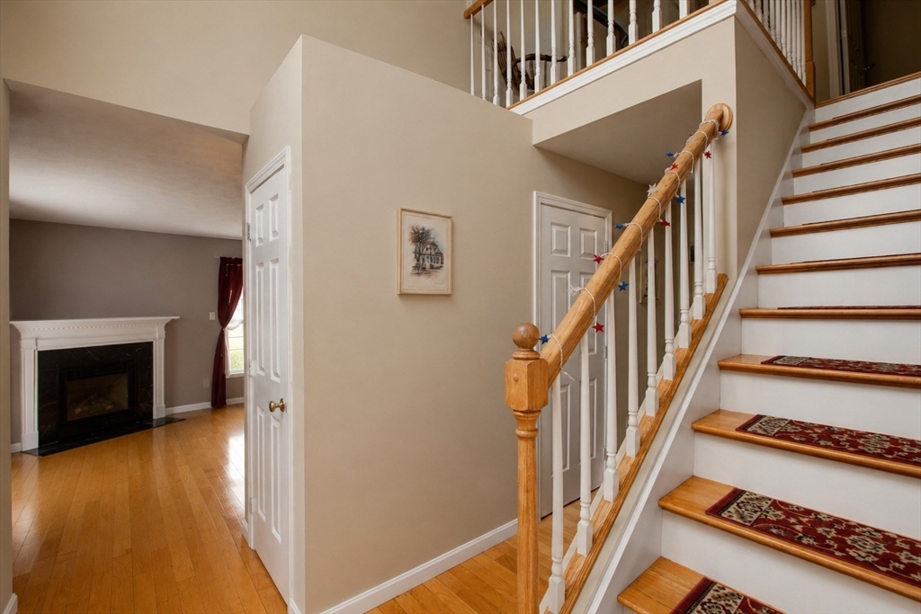 6 Loon Road Winchendon, MA 01475 - Photo 14 of 36 a view of a hallway with wooden floor fireplace and a livingroom