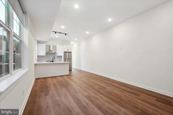 a view of kitchen with wooden floor