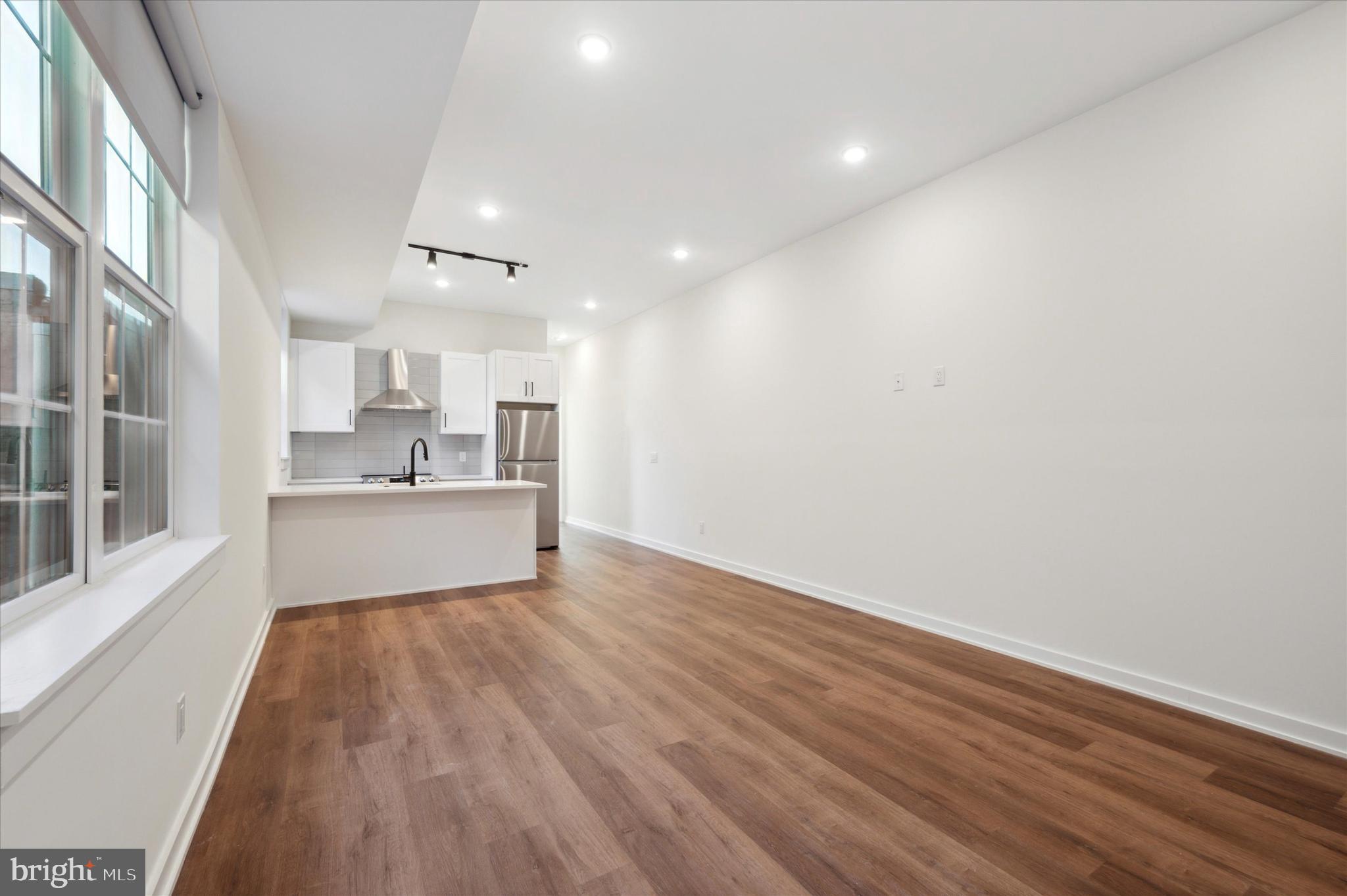 a view of kitchen with wooden floor