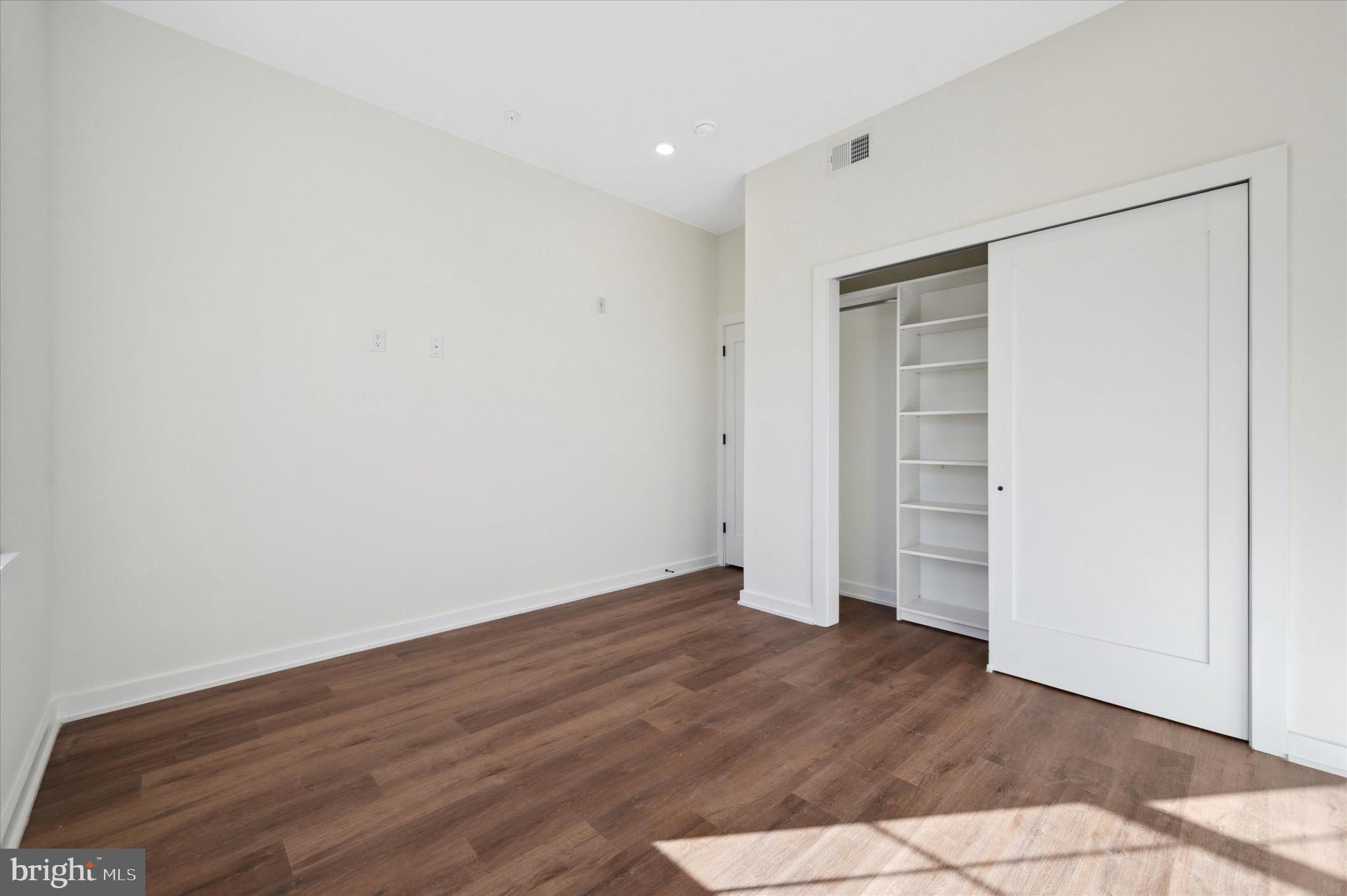 2513 North Howard Street, Unit 303 Philadelphia, PA 19133 - Photo 13 of 24 a view of empty room with wooden floor