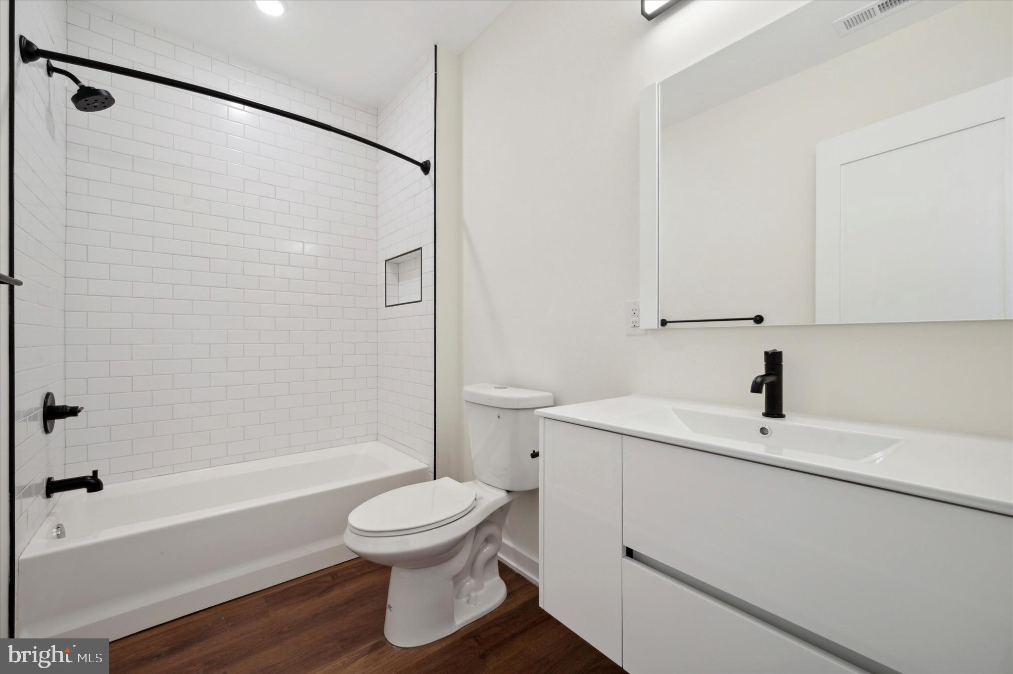 2513 North Howard Street, Unit 303 Philadelphia, PA 19133 - Photo 14 of 24 a bathroom with a sink toilet and shower