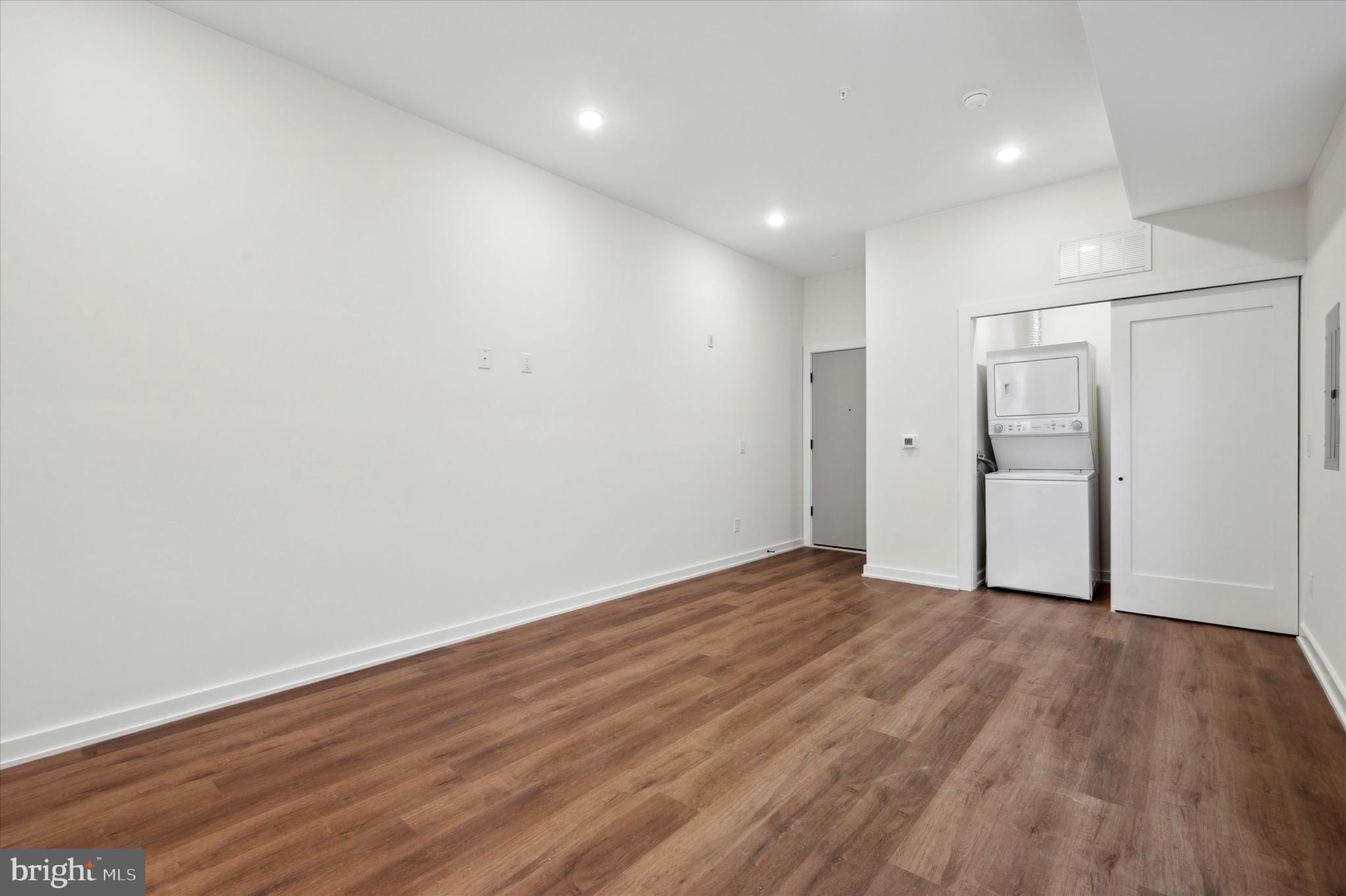 2513 North Howard Street, Unit 303 Philadelphia, PA 19133 - Photo 15 of 24 a view of an empty room with wooden floor