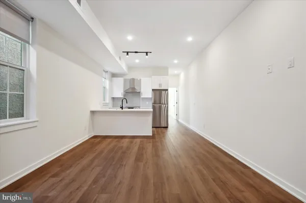 a view of kitchen with wooden floor